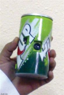ضبط كاميرات ممنوعة على شكل مشروب غازي بالجوف